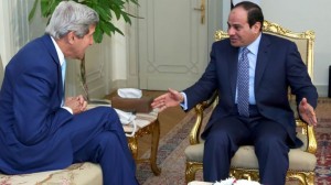 U.S. Secretary of State John Kerry, left, talks with Egypts President Abdel Fattah el-Sisi before a meeting at the presidential palace in Cairo.  /AP/MENA