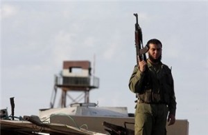 a-member-of-hamas-security-forces-stands-guard-on-the-palestinian-side-of-rafah