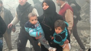 A Syrian woman with children in Aleppo on Dec. 15.  /CNN/AFP/ Getty