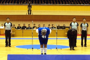 Dennis Rodman delivers a full bow to Kim Jong-Un before a recent basketball game in Pyongyang. / Kim Kwang Hyon / AP