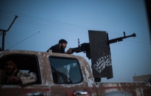 An Islamist fighter takes position on the back of truck in Raqa.  /AFP/Alice Martins