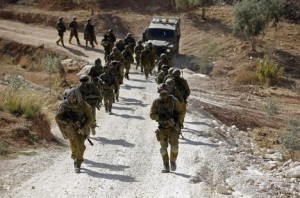 Israeli soldiers leave after an operation near the West Bank village of Bilin, near Ramallah.