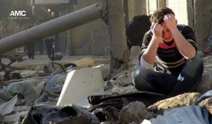 A Syrian man mourns amid the rubble following a government airstrike in Aleppo.  /AP