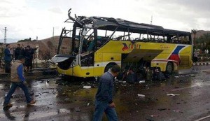 the wreckage of a tourist bus at the site of a bomb explosion in the Egyptian south Sinai resort town of Taba.
