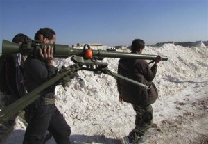 Free Syrian Army fighters carry a weapon in Sheikh Najjar in Aleppo March 20. /Reuters/Houssam Abo Dabak