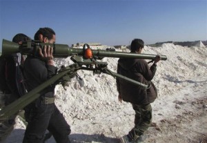 Free Syrian Army fighters carry a weapon in Sheikh Najjar in Aleppo March 20.  /Reuters/Houssam Abo Dabak