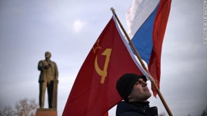 A Crimean man holds a Soviet Union flag in Lenin Square in Simferopol, Ukraine, on March 16.  /CNN/Getty Images