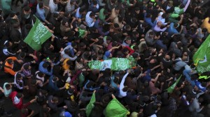 Palestinians carry the bodies during the March 22 funeral for three Hamas operatives, including Hamza Abu Al Haija.  /Reuters