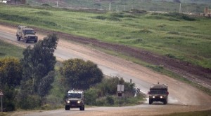 Israeli military vehicles patrol border with Gaza after another barrage of rockets hit southern Israel. / Getty