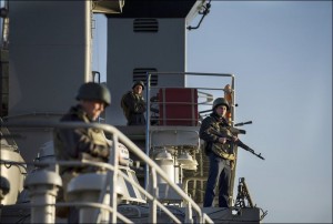 Ukrainian sailors guard their ship, Slavutich, in Sevastopol on March 3. / Andrew Lubimov / AP