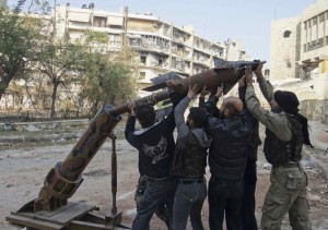 Free Syrian Army fighters prepare to launch a locally made rocket in Aleppo.  /Reuters