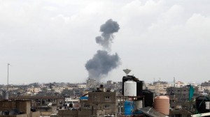 Smoke rises following an Israeli air strike on the southern Gaza town of Rafah on March 13.  /AFP/Said Khatib