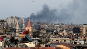 Columns of smoke rising from heavy shelling in the Jobar neighborhood in west Damascus.  /AP/Hassan Ammar)