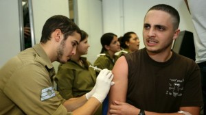 An Israeli recruit on his first day of military service gets a vaccine injection (photo credit: Moshe Shai/Flash90) Read more: In Arab Israel, a battle over Christian conscription | The Times of Israel