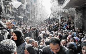 Hell: Food lines in February in Damascus await assistance by the UN’s Relief and Works Agency.   Daily Telegraph