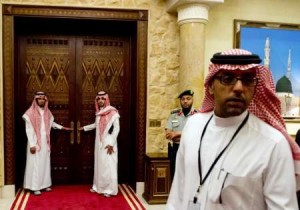 Aides stand outside the room where President Barack Obama was meeting with Saudi King Abdullah on March 28.