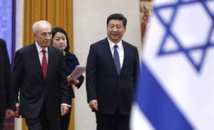 Israeli President Shimon Peres and Chinese President Xi Jinping arrive for a welcome ceremony at the Great Hall of the People in Beijing on April 8. /Reuters/Jason Lee