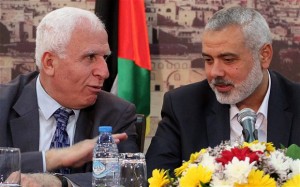 Hamas Prime minister Ismail Haniyeh, right, and senior Fatah official Azzam Al Ahmad.  /EPA