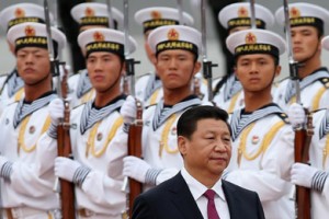 Chinese President Xi Jinping passes by a PLA navy guard of honor. /Getty Images/Li Feng