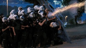 Turkish riot police fire tear gas canisters to disperse protesters near Taksim Square in June 2013.
