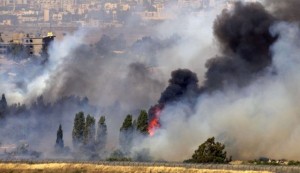 Fire caused by clashes between the Syrian Army and rebels near Quneitra.