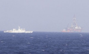 A Chinese coast guard ship near the Chinese oil rig Haiyang Shiyou 981 in the South China Sea, 130 miles off Vietnam’s shore.  /Nguyen Minh/Reuters