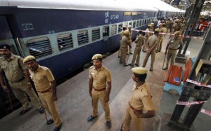 ndian policemen stand guard next to a passenger train that was ripped by two blasts at the railway station in Chennai, India on May 1.  /AP/Arun Sankar