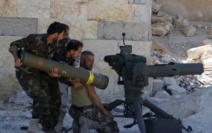 Syrian rebels load an anti-tank missile.  /Reuters/Rasem Ghareeb