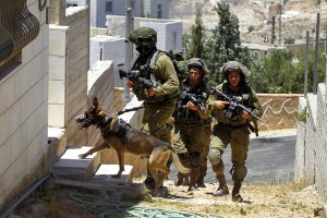 Israeli soldiers searched for three teenagers Sunday in the southern West Bank city of Hebron.  /Abed Al Hashlamoun/EPA