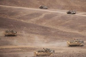 U.S. amphibious assault vehicles carry infantry Marines while M1A1 Abrams tanks provide direct-fire support during Eager Lion-2014 exercises.  /U.S. Marine Corps photo by Sgt. Austin Hazard