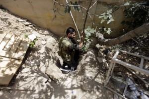 A Syrian army soldier descends in a tunnel reportedly previously used by rebel fighters in Jobar, a mostly rebel-held area on the eastern outskirts of Damascus on June 2.  Getty Images