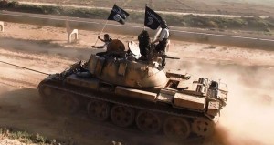 ISIL militants on a captured tank