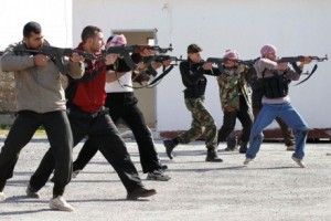 Fighters take part in weapons-training exercise outside Idlib, Syria. / AP
