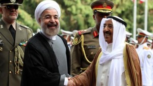 Iranian President Hassan Rouhani, left, greets the Emir of Kuwait, Sheikh Sabah Al-Ahmad Al Sabah in Teheran on June 1.  /AFP/Atta Kenare