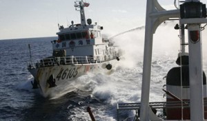 A Chinese Coast Guard vessel fires its water cannon at a Vietnamese Coast Guard ship on June 1.   