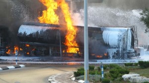 Flames rise at a gas station in Ashdod that was hit directly by rocket fire from Gaza on the fourth day of Operation Protective Edge, July 11.