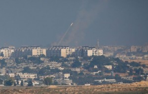 A rocket is fired towards Israel from the northern Gaza Strip on July 11.  /Ronen Zvulun/Reuters