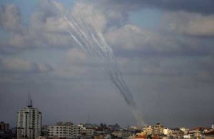 Smoke from rockets fired from a northern neighborhood of Gaza City are seen after being launched toward Israel on July 17.