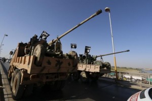 ISIL fighters move artillery in Raqqa, northern Syria.  /Reuters