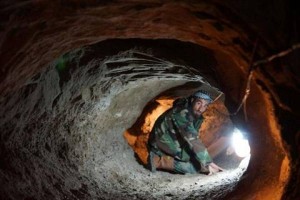 Syrian rebel in a tunnel near Damascus.