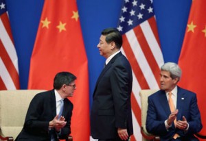 Chinese President Xi Jinping walks past U.S. Secretary of Treasury Jack Lew, left, and U.S. Secretary of State John Kerry in Beijing on July 9.  /Feng Li/Getty Images/AsiaPac