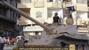 ISIL fighters drive a tank through the Syrian city of Al-Raqqah.  /State of Al-Raqqah