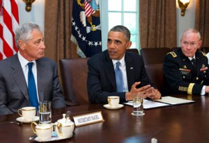 U.S. President Barack Obama meets with Defense Secretary Chuck Hagel, left, and Gen. Martin Dempsey.  /AP/Jacquelyn Martin