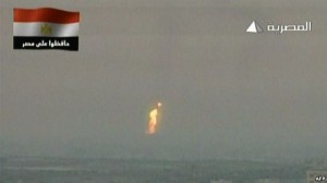 An image grab taken from Egyptian state television shows what the channel said is a flame rising from the site of an attack on a gas pipeline.  /AFP/Al-Masriya TV