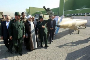 A handout picture released by the official website of the Iranian President, shows president Hassan Rowhani, center, and Iran's Defense Minister Hossein Dehqan, second right, visiting Iran's defense capabilities exhibition on Aug. 24 in Teheran.   /AFP
