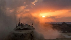 An Israeli Merkava tank rolls back from the Gaza Strip to an army deployment near Israel's border with the Palestinian enclave on Aug. 3.  /Jack Guez/AFP/Getty Images