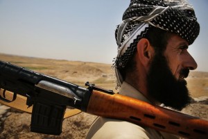 A soldier with the Kurdish peshmerga pauses at an outpost on the edges of the contested city of Kirkuk, Iraq on July 3.   /Spencer Platt/Getty Images