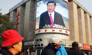 A screen at a Beijing junction shows a speech by Xi Jinping.  /Wang Wei/EPA