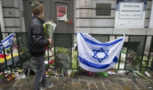 Flowers are left outside the Jewish Museum in Brussels in tribute to those killed in a May terrorist attack.