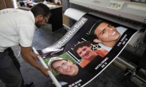 A poster shows murdered Israeli teens Eyal Yifrach, Gilad Sha'ar and Naftali Fraenkel.